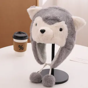 Detail shot of plush husky winter hat featuring soft faux fur and gray pompom earflaps