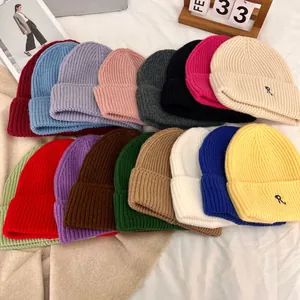 Multi-color knit beanies with R-letter embroidery in a soft autumn winter style