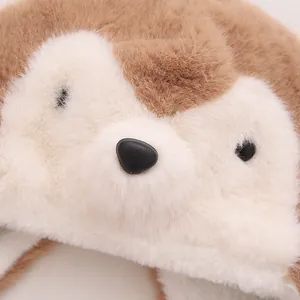 Close-up of cute plush bear hat featuring soft brown faux fur and detailed embroidery
