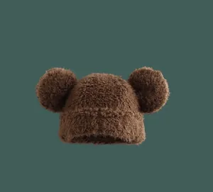 Close-up of thick plush bear ear beanie in brown faux fur with soft fuzzy texture