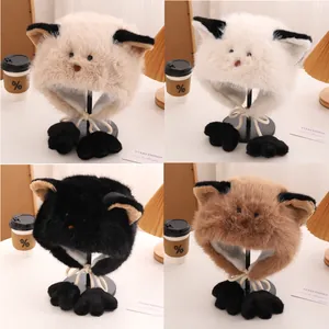 Detail view of plush cat ear winter hats in four colors with cute paw charms and strings