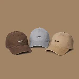 Detailed embroidery on cotton baseball caps in brown, dark grey and khaki colors