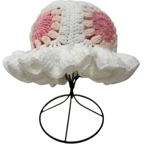Handmade crochet ruffled bucket hat with pink floral grandmother square patterns
