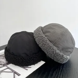 Winter docker hats in black and dark grey with warm fleece trim and windproof fabric