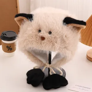Detail of plush cat ear hat with soft faux fur texture and black paw-shaped pompom ties