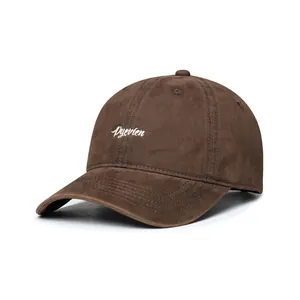Detailed embroidery of Pyevien text on a brown brushed fabric baseball cap with curved brim
