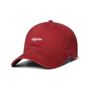 Close-up of Pyevien letter embroidery on a dark red twill cotton baseball cap