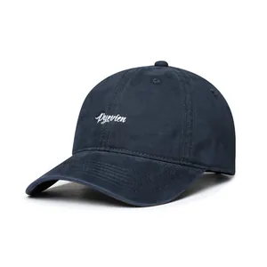 Detail of navy blue washed cotton baseball cap with white Ryevten embroidery and stitching