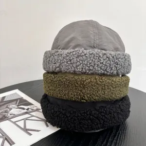 Three-color wool sherpa patchwork skull caps in gray, olive green, and black set