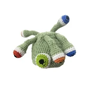 Green knit octopus beanie with funny monster eyes and colorful tentacles for winter