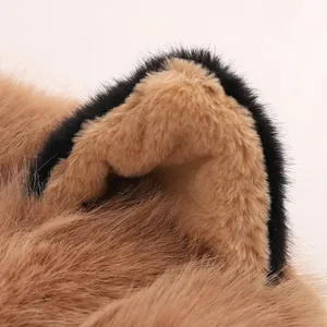 Close-up of soft plush faux fur cat ears with brown and black texture detail