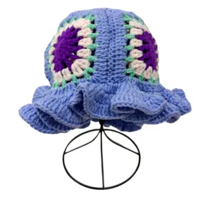 Handmade crochet bucket hat with floral patterns and wavy ruffled brim in lilac purple