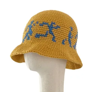 Mustard yellow knitted bucket hat with blue pixel portrait pattern for women fashion
