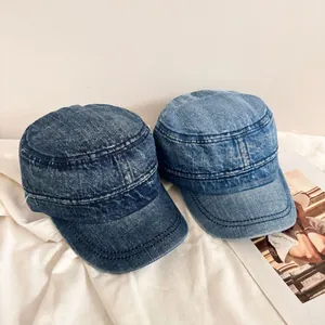 Vintage washed denim flat top military caps in dark and light blue with short brims