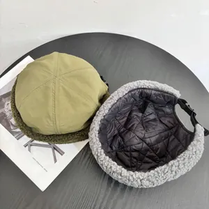 Detail of winter pilot hat featuring quilted lining and adjustable buckle strap