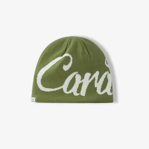 Olive green knitted beanie with white street style jacquard lettering and woven label