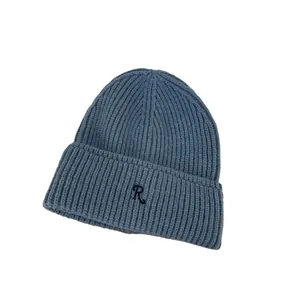 Winter knitted beanie in grey blue featuring a ribbed texture and embroidered letter R