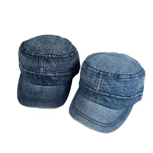 Vintage washed denim cadet caps in dark and medium blue with classic flat top design