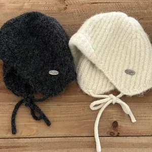 Winter wool knit aviator beanie with earflaps and ties in grey and cream white colors
