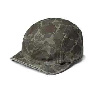 Detail view of the durable canvas material and metal side eyelets on camo five-panel cap
