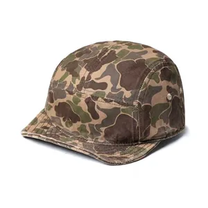 Detail view of 5-panel duck hunter camo cap featuring metal eyelets and canvas texture