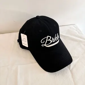 Detail of vintage black baseball cap with white Brklyn embroidery and original brand tag