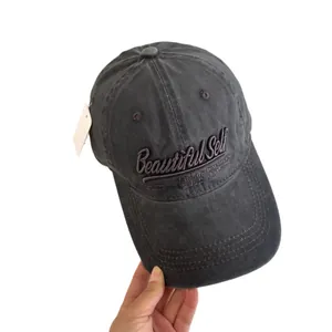 Washed cotton baseball cap in dark grey with Beautiful Self 3D embroidery detail