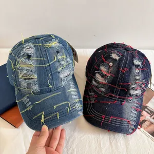 Vintage distressed denim baseball caps in light and dark blue with ripped hole details