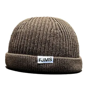 Unisex dark brown ribbed knit docker hat with FJMS woven label in vintage hip-hop style