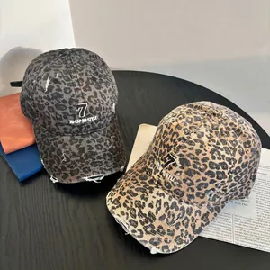 Distressed leopard print baseball cap with number 7 embroidery and vintage frayed edges