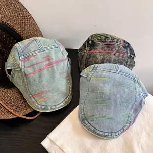Denim beret flat cap with rainbow stitching in dark blue light blue and grey