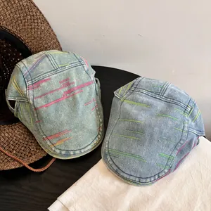 Classic washed denim flat caps with colorful stripe embroidery in blue retro style