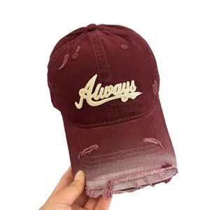 Distressed burgundy baseball cap with vintage embroidery and worn-out brim details
