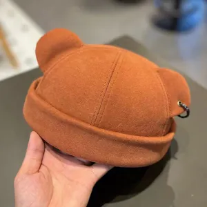 Caramel brown docker hat with cute bear ears and metal ring detail for a trendy autumn look