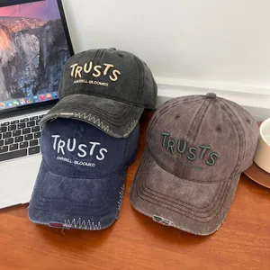 Vintage washed cotton baseball caps with distressed embroidery in black, blue and brown