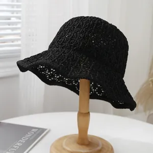 Close-up of black crochet straw bucket hat featuring a breathable hollow mesh weave design