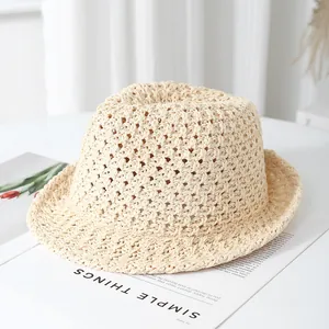 Detailed macro view of the breathable hollow knit pattern on this beige sun bucket hat
