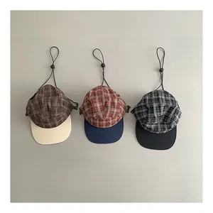 Three vintage plaid baseball caps in brown, red, and grey with adjustable windproof cords