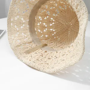 Detailed interior of beige woven sun hat with adjustable drawstring and sweatband