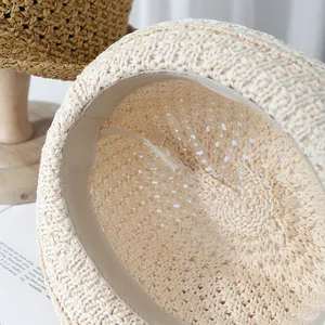 Detailed interior view of a beige crochet sun hat with adjustable drawstring and sweatband