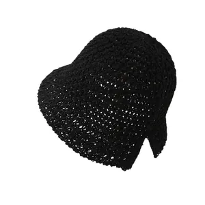 Minimalist black knit bucket hat with a unique back slit design and breathable texture