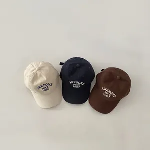 Retro baseball caps in beige, navy and brown with vintage Awesome Since 1987 embroidery