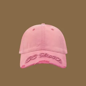 Pink washed cotton baseball cap with vintage embroidery and distressed details