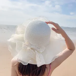 Cappello da sole in paglia da spiaggia per donna con tesa larga in organza e fiocco in pizzo