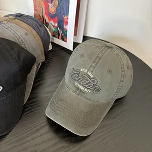 Army green washed cotton baseball cap with London embroidery and assorted vintage colors