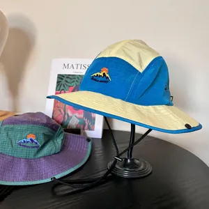 Outdoor color-block hiking hat with mountain embroidery and adjustable wind rope