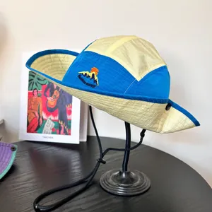 Close-up of mountain embroidery and ripstop nylon fabric on the outdoor camping sun hat