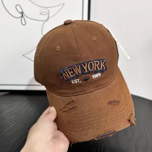 Detail of vintage distressed brown baseball cap with NEWYORK 1989 letter embroidery