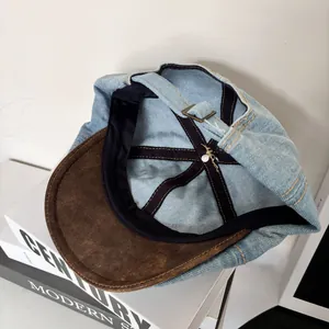 Detail view showing inner sweatband and metal adjustment buckle of the denim cap