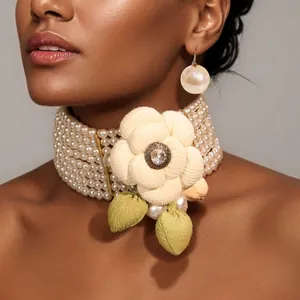 Elegant multi-layer faux pearl choker with camellia flower and matching pearl earrings